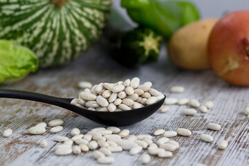raw white beans with vegetables for cooking background