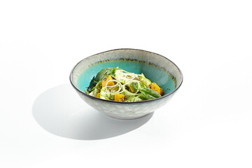 Fresh healthy food - green salad with avocado, mango. Vegetarian dish for restaurant on white...
