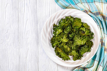 white plate with kale chips on the table