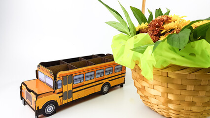 an image of a yellow school bus on a light background. a bouquet of flowers for September 1.I'm...