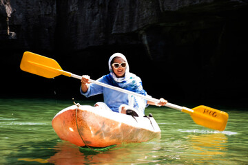 Traveler thai women paddle canoe boat of local trip tour in sea ocean travel visit Ko Khao Yai...