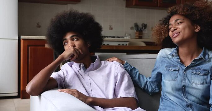 Loving Black wife encourage support depressed husband in hard life situation give hope optimism assure in overcoming problem. Young female apologize ask forgiveness of resentful male spouse partner