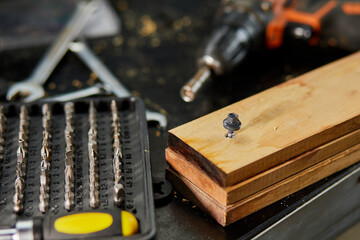 A box of metal steel heads and bits with different types for screwdriver in the workshop