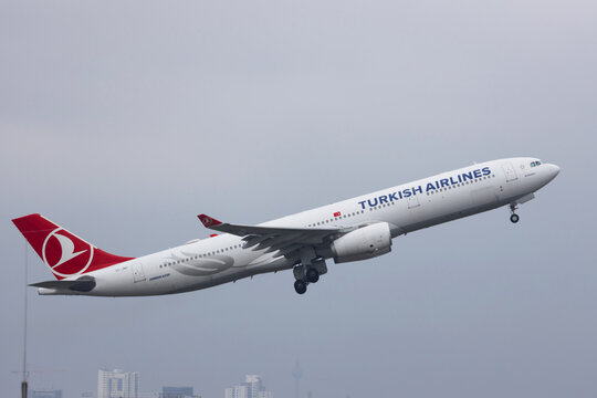 berlin,berlin /germany - 24 04 2022: an turkish airlines airplane over the cityscape of berlin