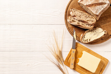 Bread with dried fruits and butter. Healthy home baked loaf top view