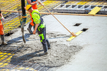 Concrete pouring on the construction site.