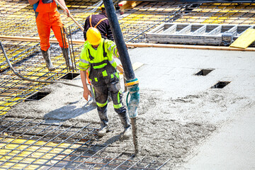 Concrete pouring on the construction site.