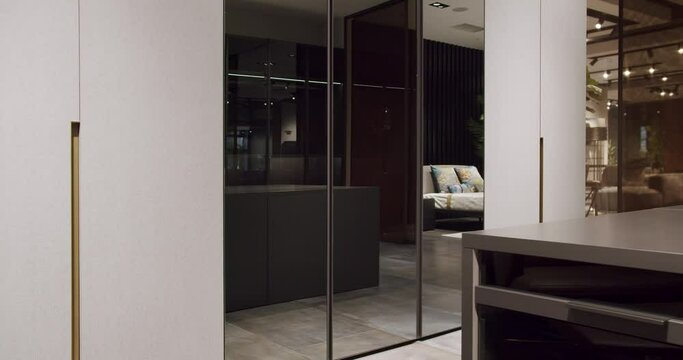 Dressing room with things. Elegant Wooden Built Walk In Closet Decoration. Luxury Dressing Room. Modern Sliding Doors. Black wardrobe with Sliding Black Doors. , Luxury Bedroom With Walk In Closet.