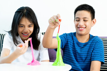 Homemade Toy Called Slime, Kids having fun and being creative by science experiment