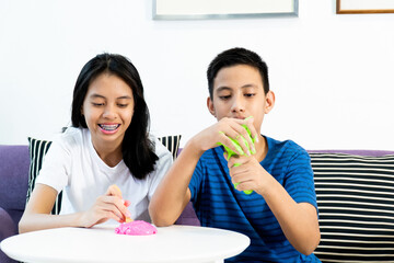 Homemade Toy Called Slime, Kids having fun and being creative by science experiment