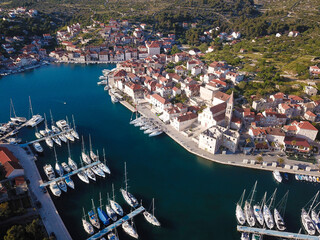 Milna village in Croatia on the island Brac and  sailboats, drone view