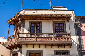 Teror at Gran Canaria, Spain. A beautiful traditional town with colorful houses with wooden...