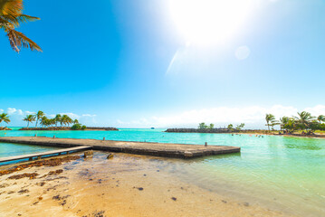 Sun shining over Bas du Fort beach in Guadeloupe