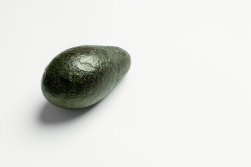 Ripe green avocado on white background.