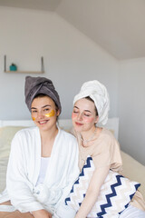 Two girlfriends make face masks at home. Preparing for a hen party. Preparing for the celebration. Girls bring beauty. Skin care.