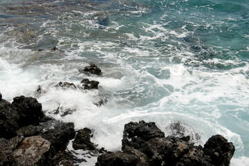 background of beautiful photography of the rocky coast of the clear blue sea