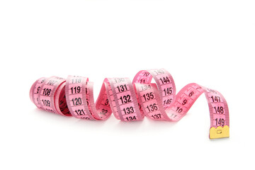 Pink plastic measure tape with metric scale isolated on white background.