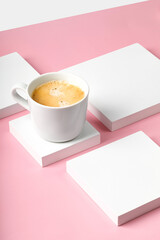 One coffee cup with cappuccino on square white podium and pink background. Espresso, ristretto...