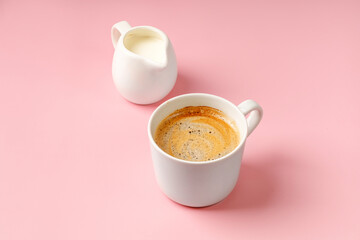 One coffee cup with Cappuccino and milk on pink background. Espresso drink with foam. Copy space