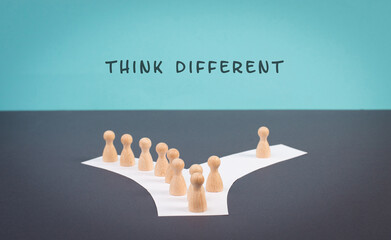 Think different stands on the blue background, one nonconformist is standing out from the crowd,...