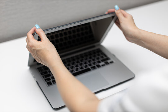 Woman Closes Laptop Lid With Her Hands