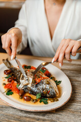 dish plate with whole fried fish in a restaurant