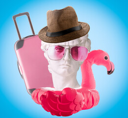 Collage of David's head, inflatable flamingo, hat, pink glasses and suitcase on  blue background. Summer travel poster concept.