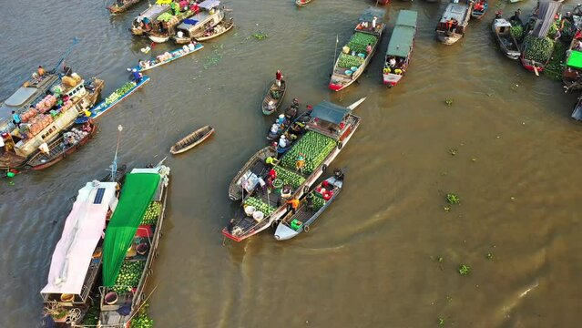 Boats on Mekong River at Cai Rang Floating Market in Asia, Vietnam, Mekong Delta, Can Tho, in summer on a sunny day.