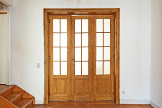 Interior aged wooden door with glasses frames