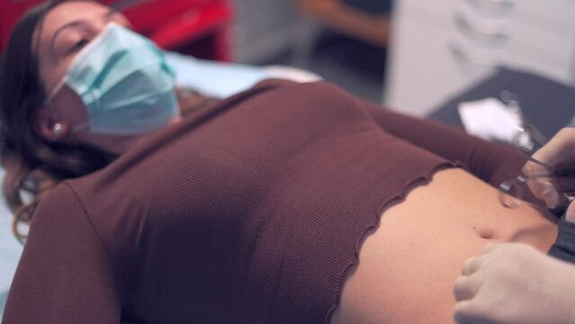 Body modification artist preparing client for piercing