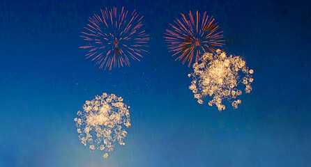 Fototapeta na wymiar four beautiful fireworks in night sky.Fireworks background