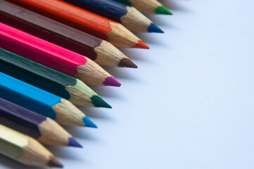 Fototapeta premium Colorful wooden pencil on white background. Copy space and educational concept