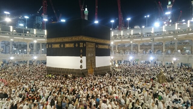 Muslim Pilgrims at The Kaaba in The Haram Mosque of Mecca , Saudi Arabia.