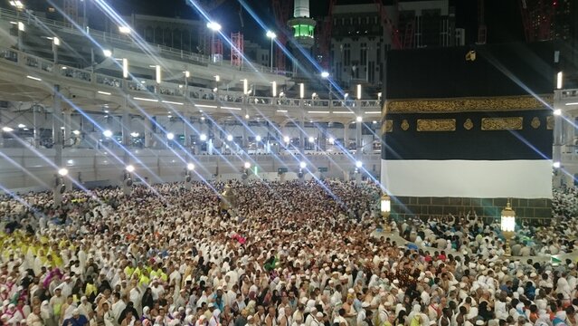 Muslim Pilgrims at The Kaaba in The Haram Mosque of Mecca , Saudi Arabia.