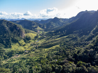 beautiful green valley with coffee, eucalyptus and banana plantation, drone aerial view - Venda Nova, Espirito Santo, Brazil