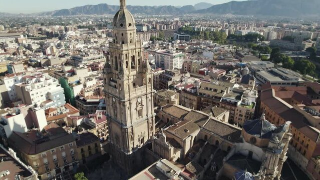 Bell tower of Murcia Cathedral with cityscape, Spain. Aerial drone pov