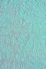 緑の和紙でできたしわのある壁紙