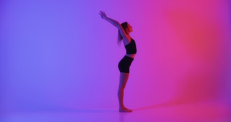 Fototapeta na wymiar Blonde woman doing yoga exercise in studio closeup