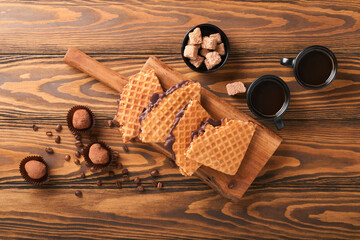 Coffee and dutch waffles. Espresso coffee and dutch waffles or syrupwaffles cookies with chocolate...