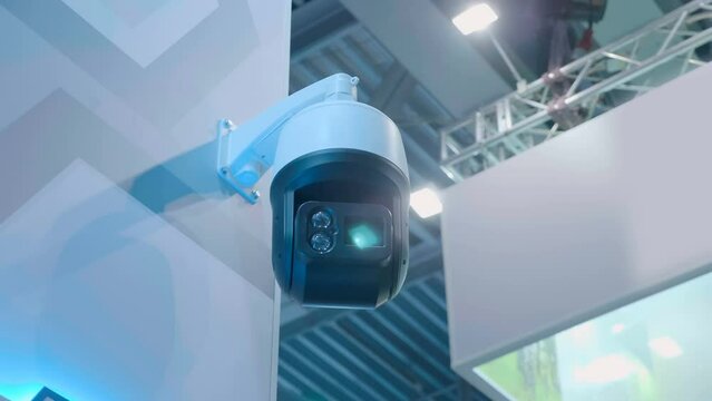 The CCTV camera perform security functions on the territory of the protected object and check the surrounding area looking for the criminal. Closeup. Shot in motion