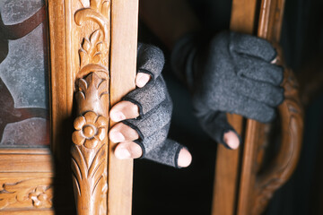 a thief open the door at night 
