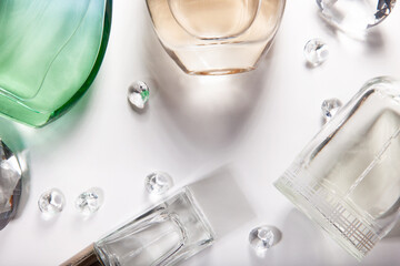 close up of a perfume glasses on pastel background
