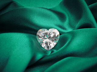 Heart-Shaped Diamond on Emerald Green Silk Background