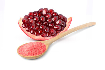 Promegranate powder in wooden spoon and fresh fruit isolated on white background.