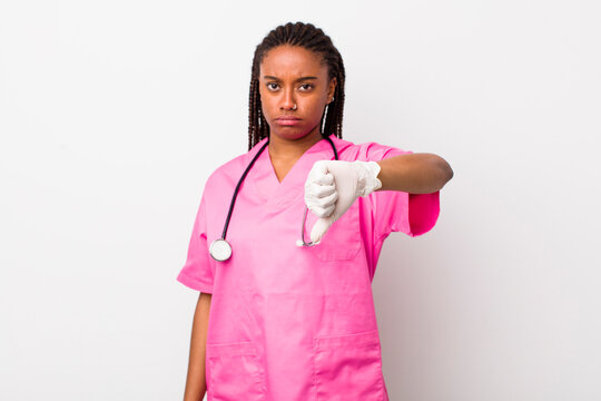 young adult black woman feeling cross,showing thumbs down. veterinarian concept