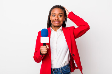 young adult black woman feeling stressed, anxious or scared, with hands on head. presenter and...