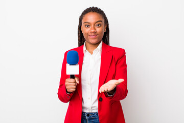 young adult black woman smiling happily with friendly and  offering and showing a concept....