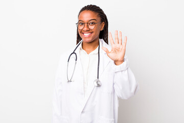young adult black woman smiling and looking friendly, showing number five. physician concept