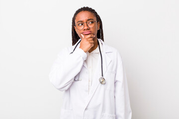 young adult black woman thinking, feeling doubtful and confused. physician concept