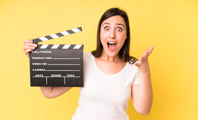 young adult pretty woman amazed, shocked and astonished with an unbelievable surprise. cinema...